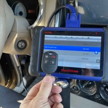 locksmith using key fob programming device on vehicle in Nevada